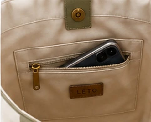 Close-up of the inside zip pocket holding a phone